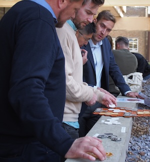 Players looking at a dinosaur digsite jigsaw